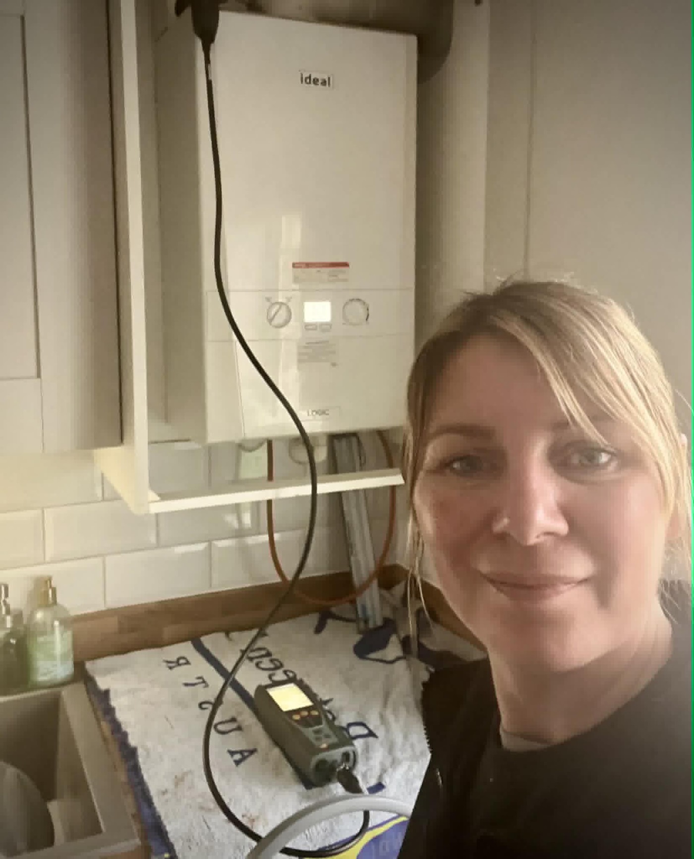 Louise Bee, female gas engineer in Norwich, after completing a job